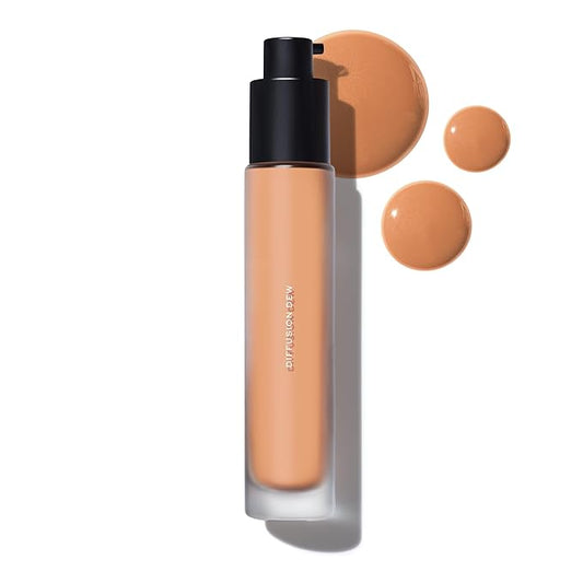 MAKE Beauty Diffusion Dew Skin Tint. Sheer to Medium Coverage Radiant Finish. Blurring, Smoothing, and Brightening for Glowing Complexion. Enhanced with Niacinamide and Adenosine. Amber 10